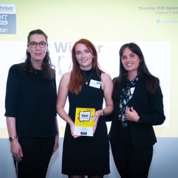 New talent awards, women holding award